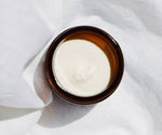 An open Jar of Somnium Nighttime GABA Cream